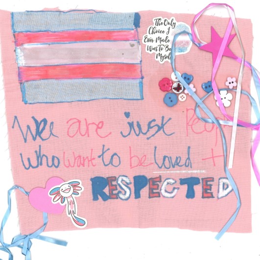 A trans pride flag with text on a pink square, decorated with stickers, buttons, and ribbons. The text reads: "We are just people who want to be loved + RESPECTED"